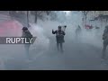 France: Tear gas flies as protesters start fires at Paris rally against security bill