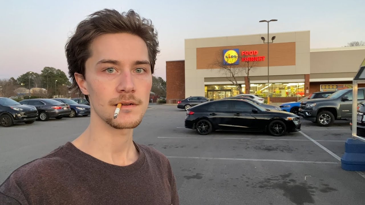 Smoking a Cigarette in a Lidl Parking Lot