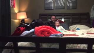 Baby laughing when mom jumps on bed