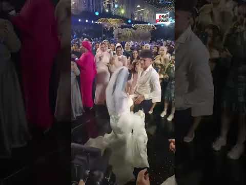 مصطفى شكشك لاعب إنبى وعروسته يحتفلان بزفافهما بالدقهلية