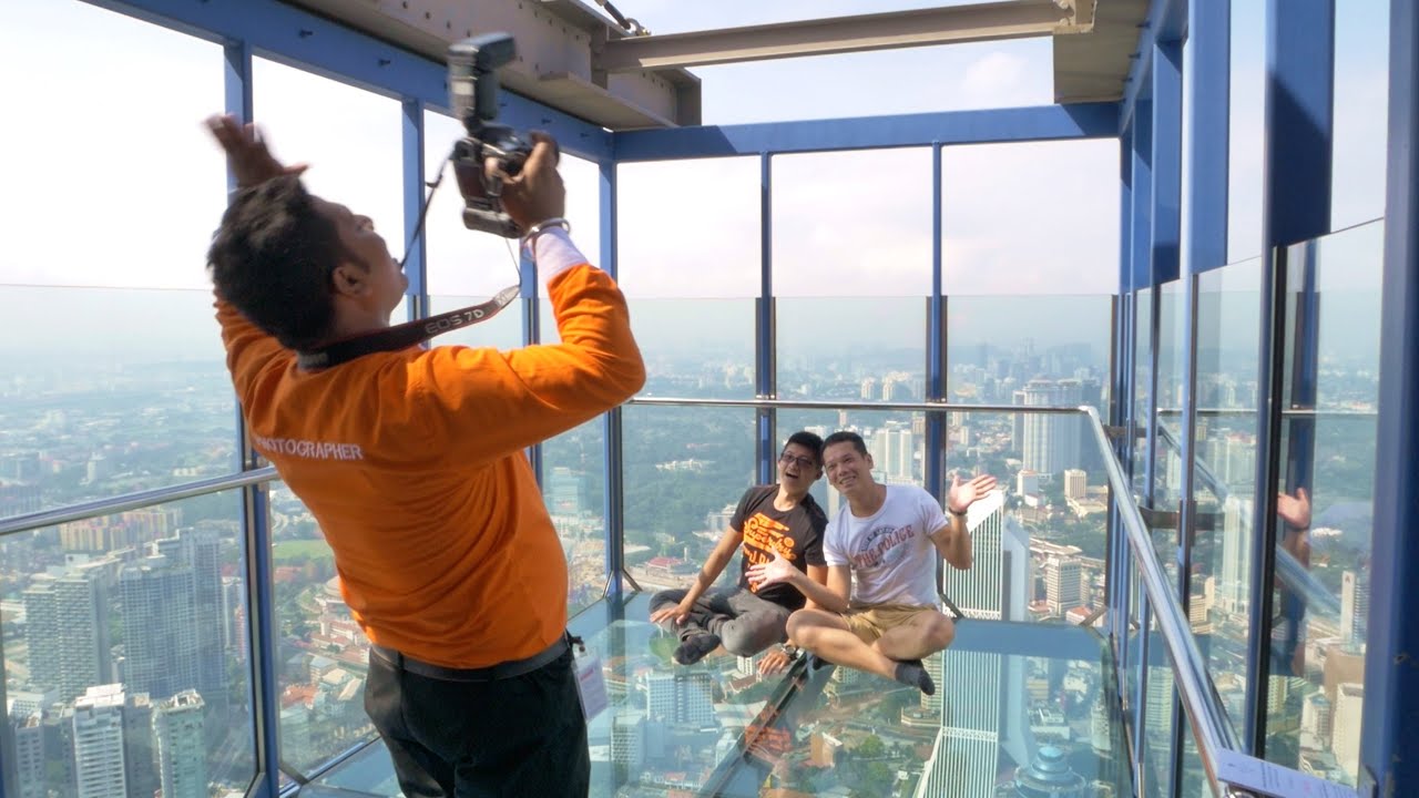 Observation Deck Kl Tower / Kl Tower Tourist Sit On Glass Stock Photo