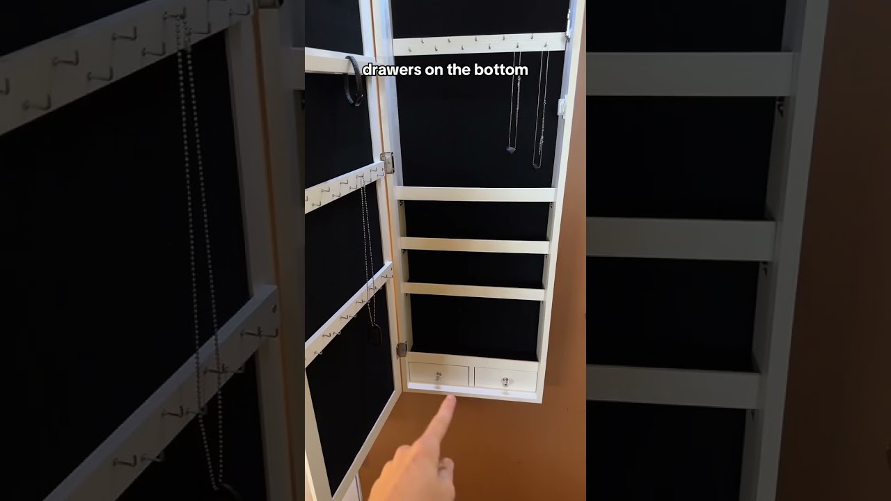 The hanging mirror jewelry cabinet is so nice! 