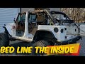 Spraying Upol Raptor bedliner on the floor of a 2012 Jeep Rubicon