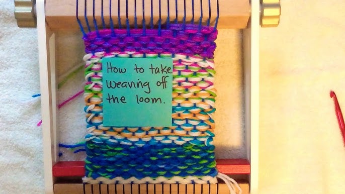 Weaving with loops on the potholder loom.AVI 