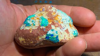Uncut gem opal cluster in sandstone. Let