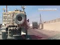 American armored vehicles move through Raqqa
