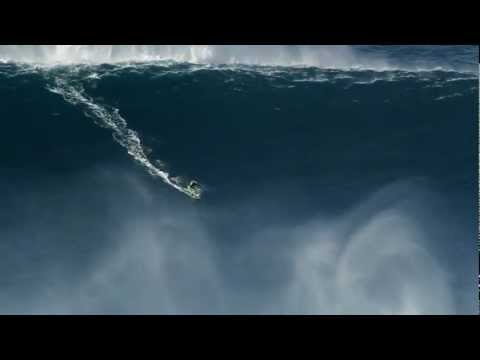 Kelly Slater and Joel Parkinson surfing big waves in Praia do Norte Nazare