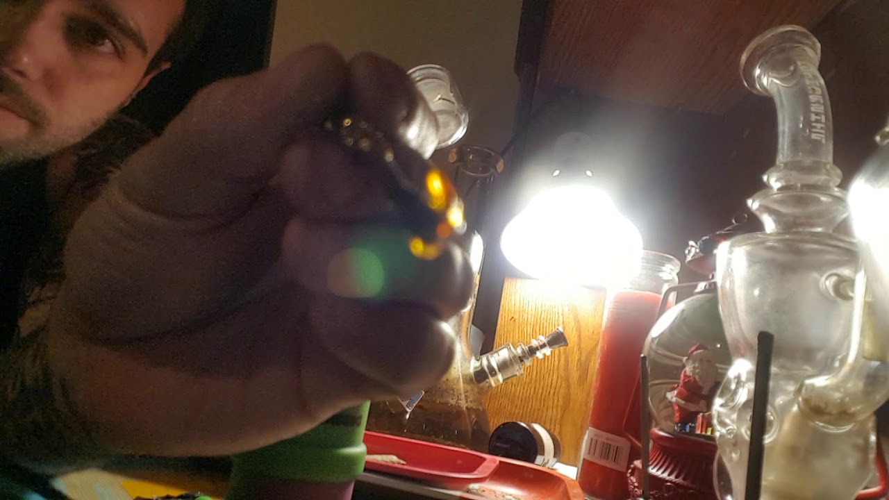 Taking a dab of some lemon OG shatter nighttime dab