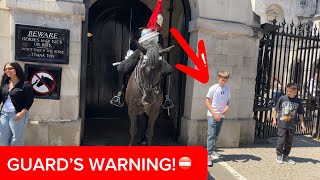 Guard Warns Boy to Stand Behind the Line!