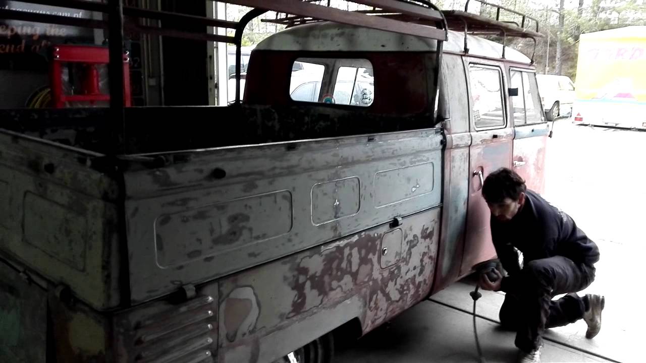 Sanding the various layers of paint to reveal the og paint.