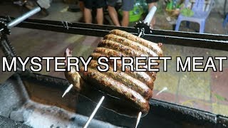 Eating unknown street meat in Vietnam Eating unknown street meat in Vietnam