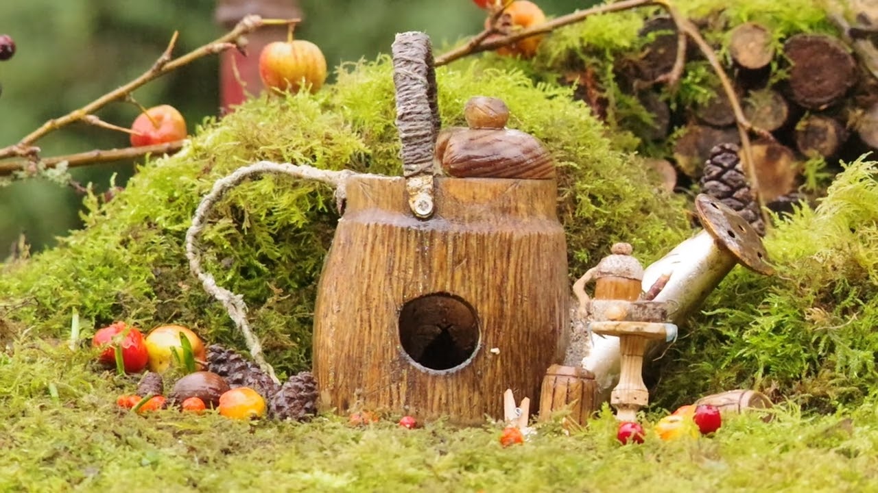 George the Mouse in a watering can house