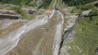 Drone Footage of a Guy Flying Down With His Speed Flying Wings to the Valley