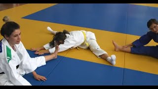 Andrea Flexes On The Judo Instructors
