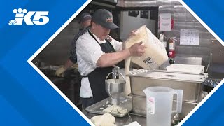 Volunteers prepare holiday meals for the homeless