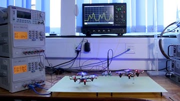 Two batteryless drones powered from a single charging pad