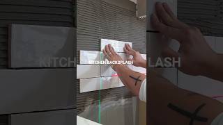 one tile at a time.Turning vision into reality — Backsplash installation underway.