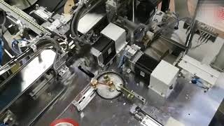 Automatic EE core assembly, taping & testing machine. newwinhk@hotmail.com