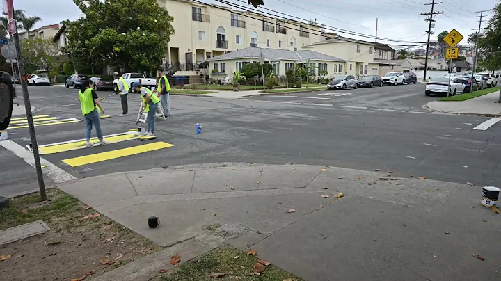 Painting crosswalks at the corner of Stoner and Nebraska in Sawtelle