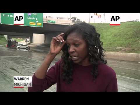 Detroit area cleans up after record rains, flooding. Freeways are swamped and cars, basements soaked