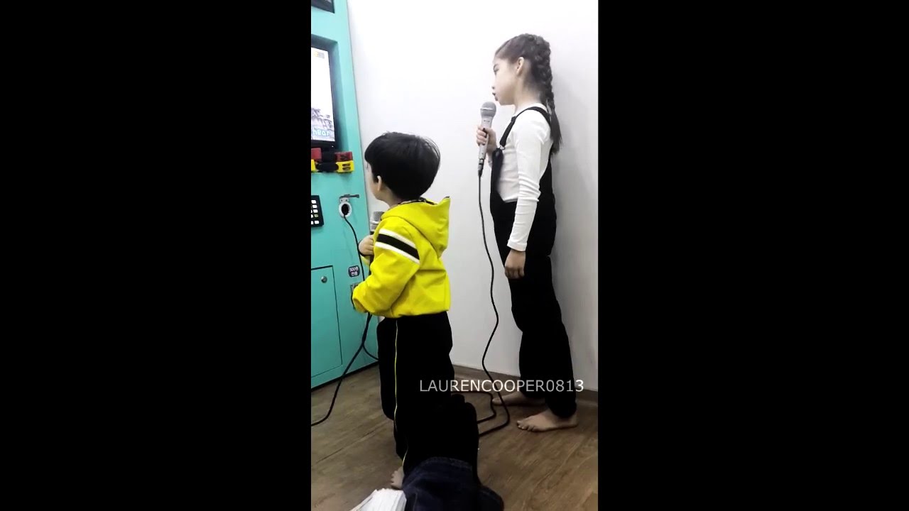 Lauren and Cooper singing at karaoke