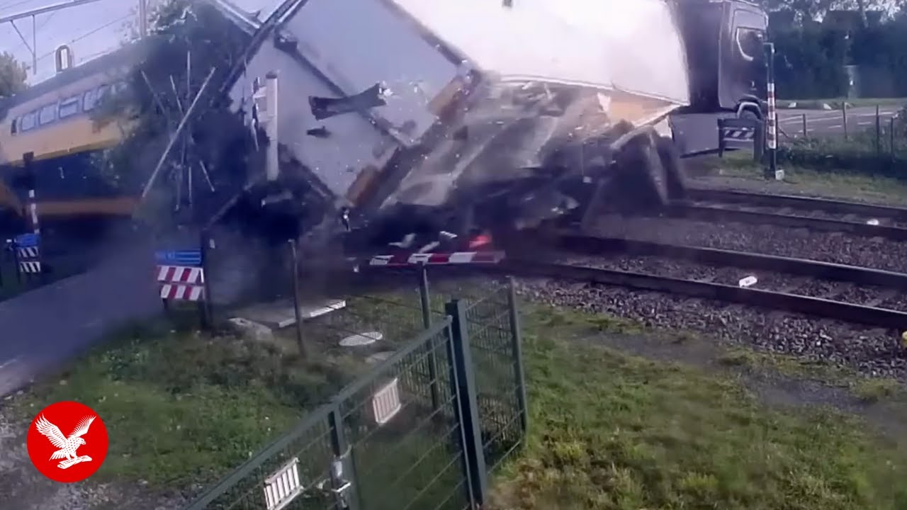 Train smashes into lorry caught on level crossing - YouTube