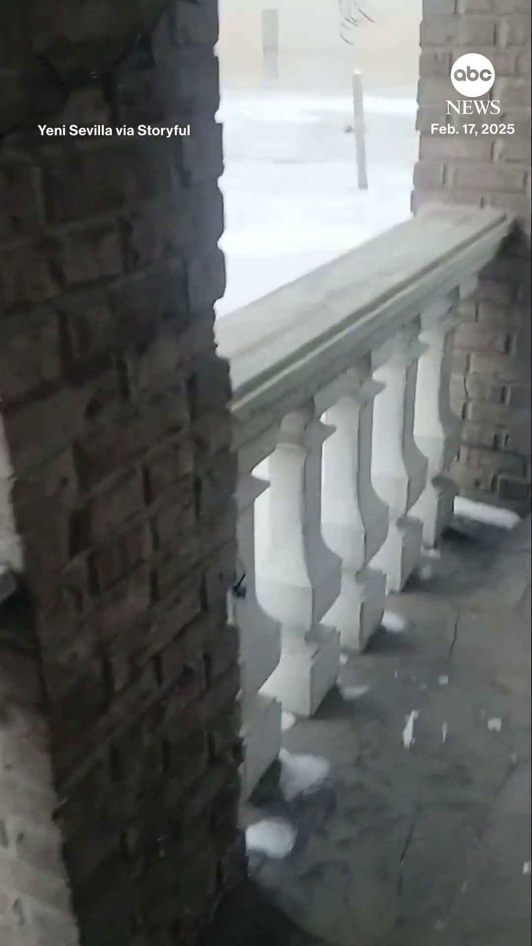 Freezing temperatures encase flooded Detroit street in ice