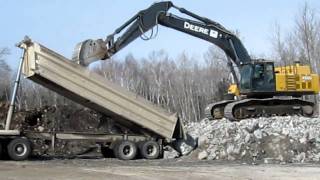 Unloading 4 foot rip rap to beef up the Diversion Dam