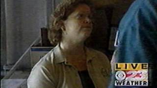 Mark Strehl inside the food pantry with Michelle. 2002