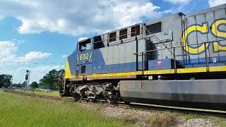 AC6000 leading Q401-29/with black CSX hopper bottoms at the rear behind the big monster train