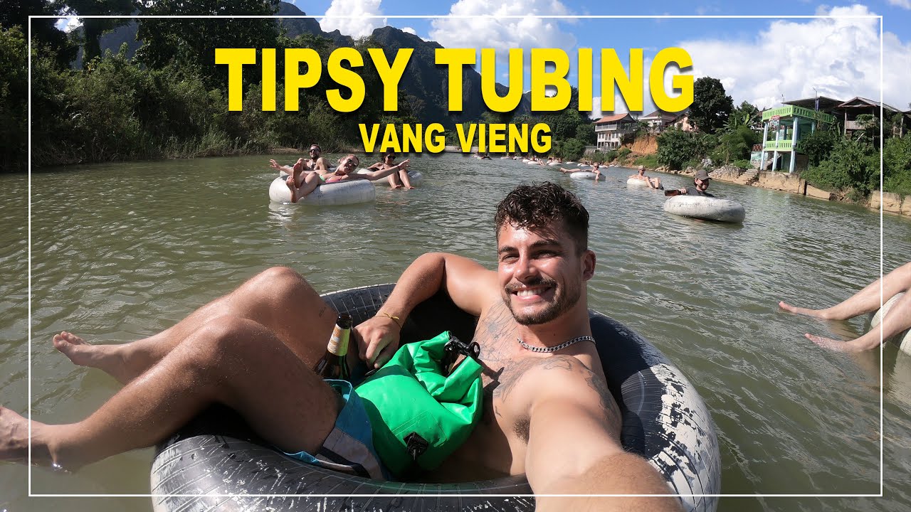 FLOATING DOWN A RIVER IN LAOS... DRUNK!