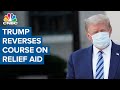 President Donald Trump reverses course on aid relief, pushes for piecemeal package