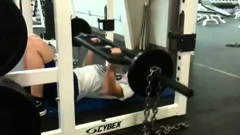 dogtownsc.com - Ashley Johnson performing Swiss Bar floor press with chains