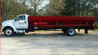 The new way to spread sawdust in mega poultry houses.