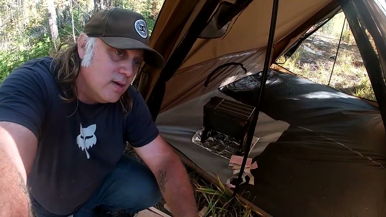 présentation  de ma tente pomoly de mon lit de camp de de mon poêle a bois