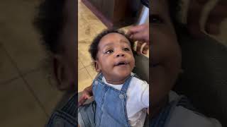 Asafa Powell plays hide and seek with son