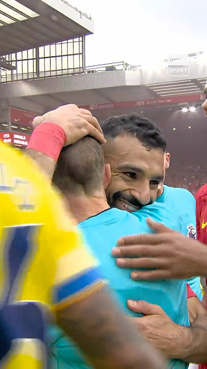 Mohamed Salah embraces retiring offical Derek Eaton as he hangs up the whistle 🥹