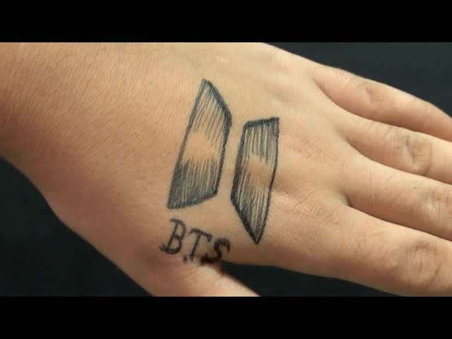 BTS spctrum heart tattoo located on the wrist.