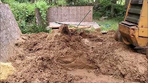 Using a Backhoe for Mixing Cob Sept17