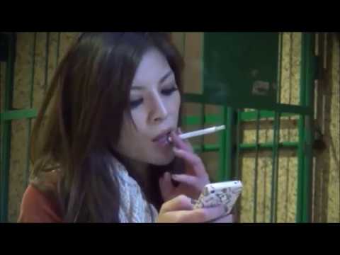 Japanese woman chain smokes all-white cigarettes