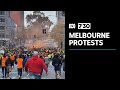 Protesters march through Melbourne's CBD in wake of construction industry shutdown | 7.30