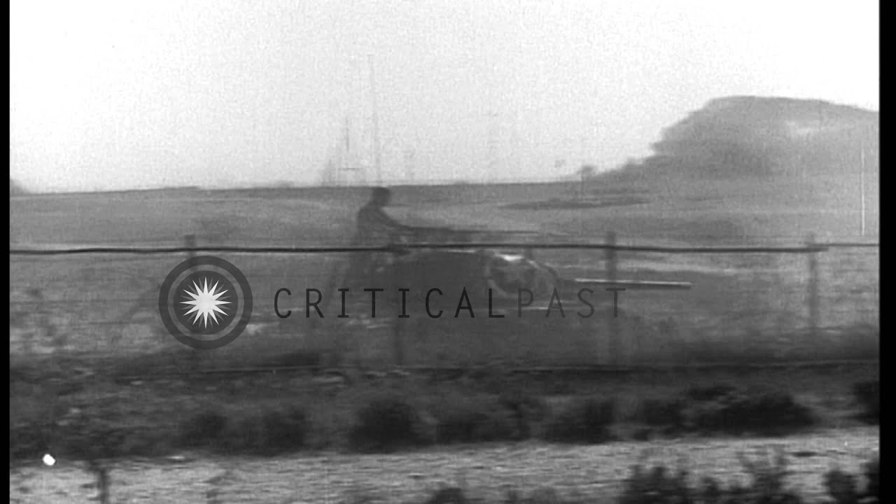 US Army soldiers riding M-4 tanks and firing 105mm Howitzer from camouflaged M-7 ...HD Stock Footage