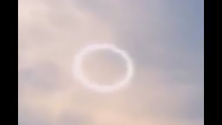 Strange White Circular Cloud Appears Then Dissolve in The Sky. Naha-shi Kumoji, Japan