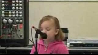 Kassidy Cook singing "make some noise"
