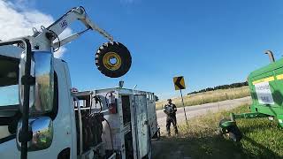 Swather tire off loading