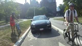 Toronto cyclists compete with vehicles on dedicated bike lanes