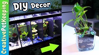 I made DIY betta fish tank decorations which were aquarium plant planters. These tank planters use black aquarium gravel and 