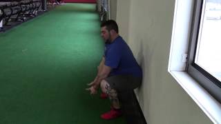 EricCressey.com: Wall Assisted Deep Squat Lower Trap Raise
