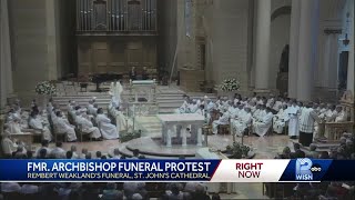 Funeral Mass for former Milwaukee archbishop draws supporters, protesters