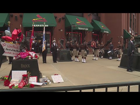 Lou Brock's family leads procession from Greater Grace Church to Busch  Stadium statue 